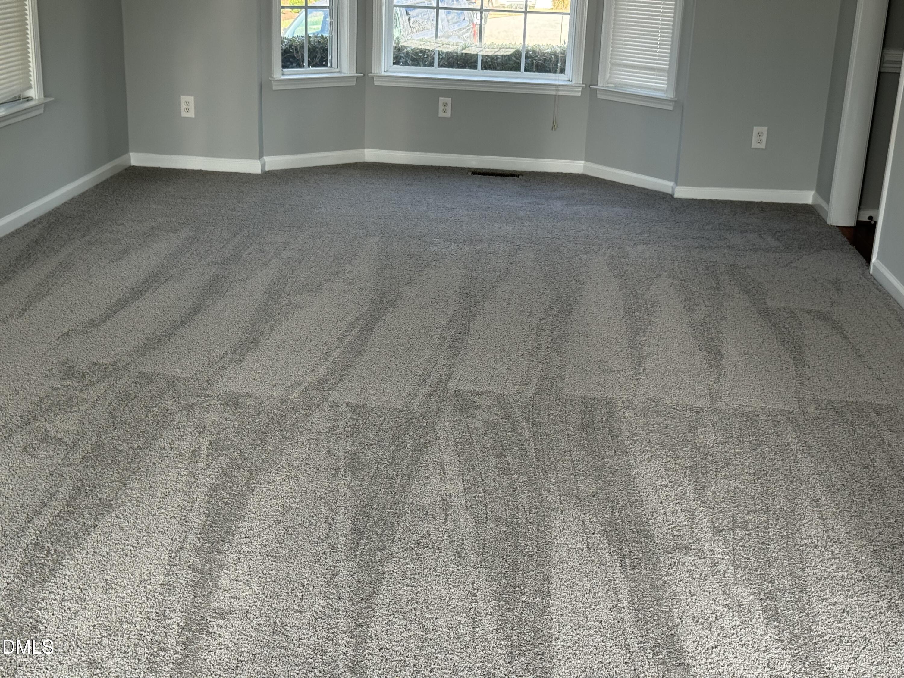 1417 Pleasant Quail Court Raleigh, NC 27603 - Photo 10 of 17 a view of an empty room with a window