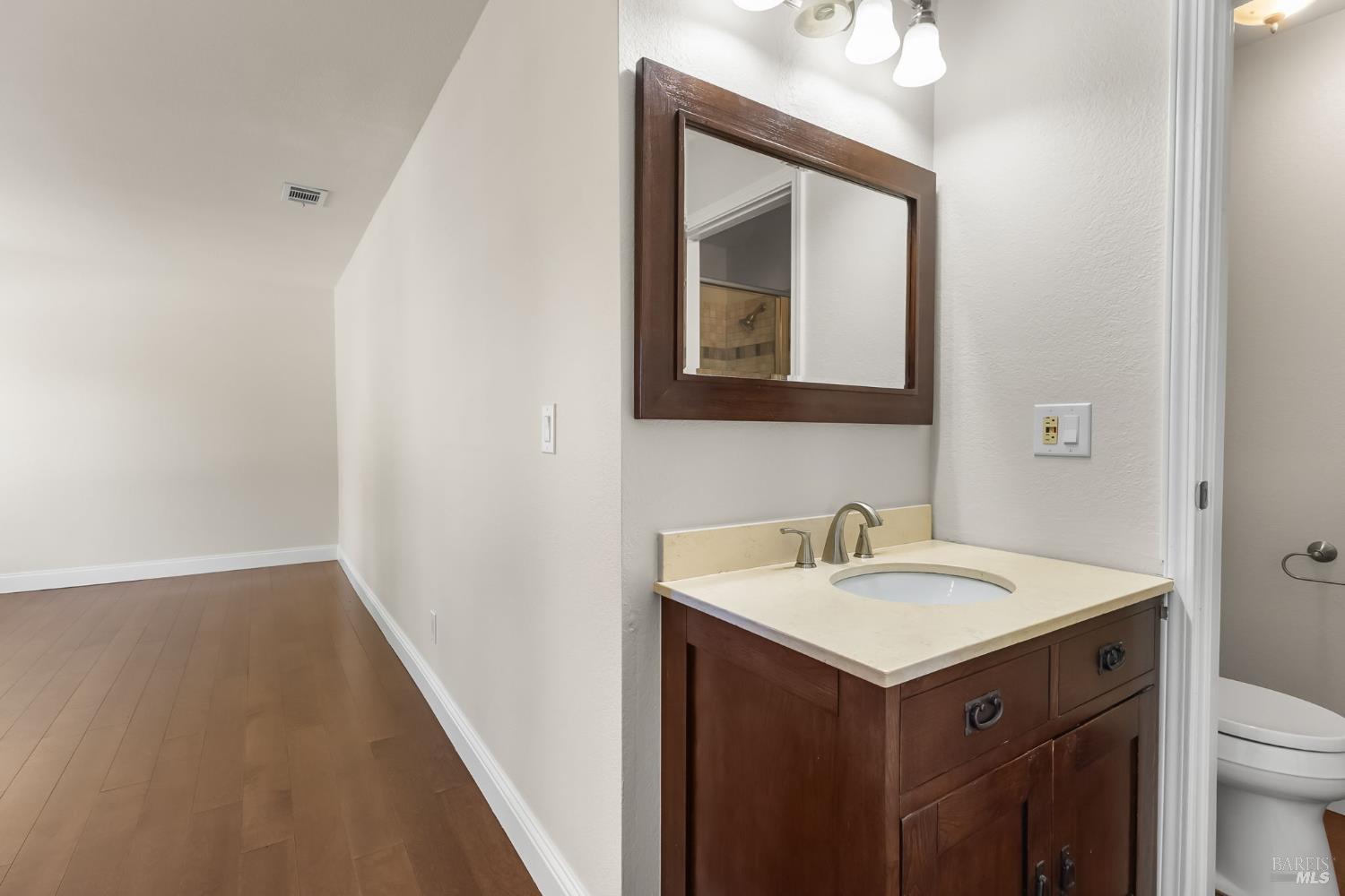 2177 Vista Del Rancho Fairfield, CA 94534 - Photo 17 of 28 a bathroom with a sink vanity and a mirror