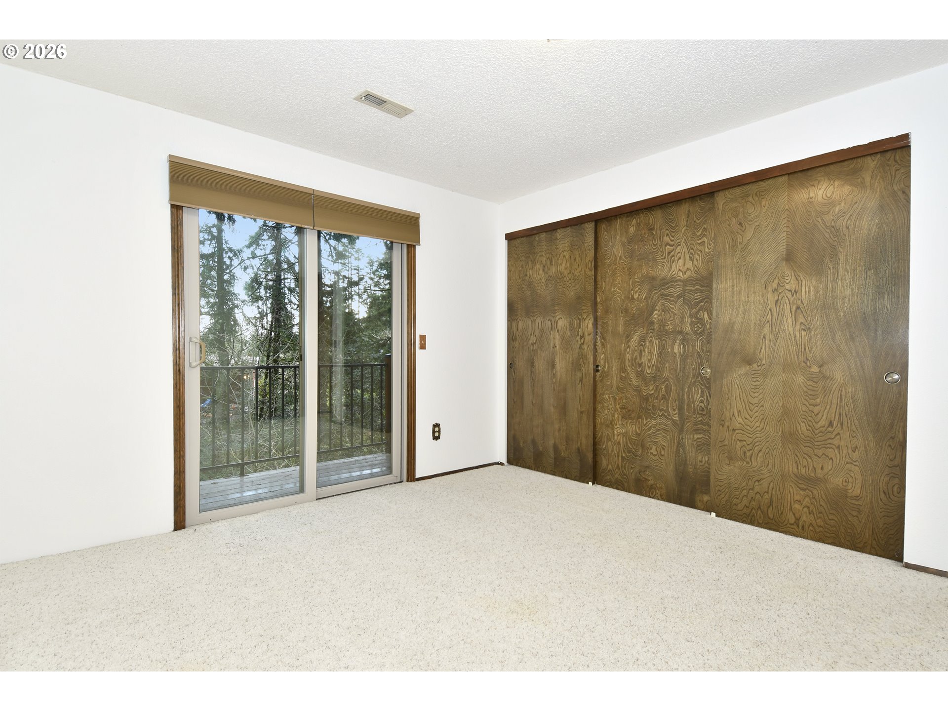 18031 Southeast 370th Avenue Sandy, OR 97055 - Photo 14 of 24 a view of an empty room with glass door
