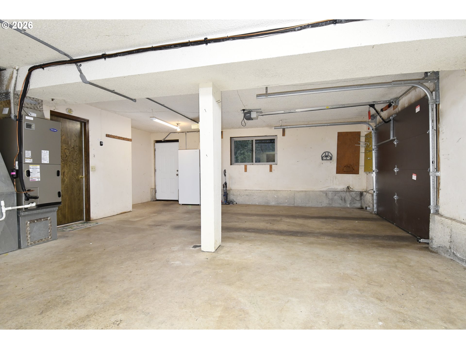 18031 Southeast 370th Avenue Sandy, OR 97055 - Photo 18 of 24 a view of a big room with wooden floor and windows