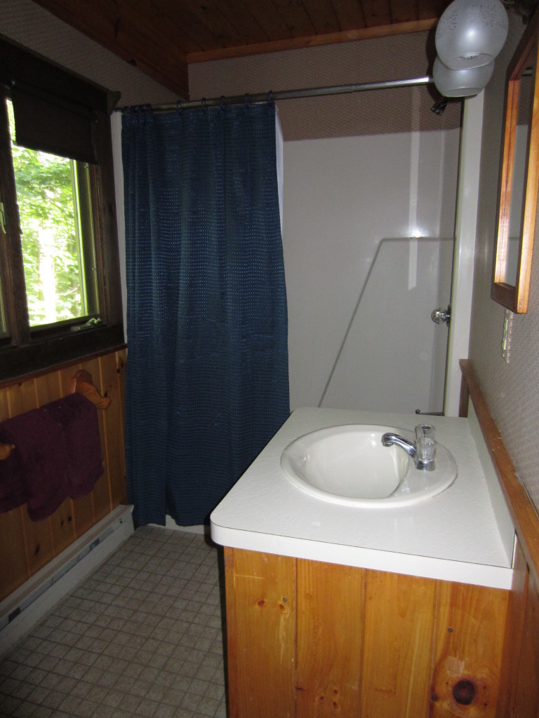 47 Slope Road Tolland, MA 01034 - Photo 13 of 19 a bathroom with a sink and a mirror