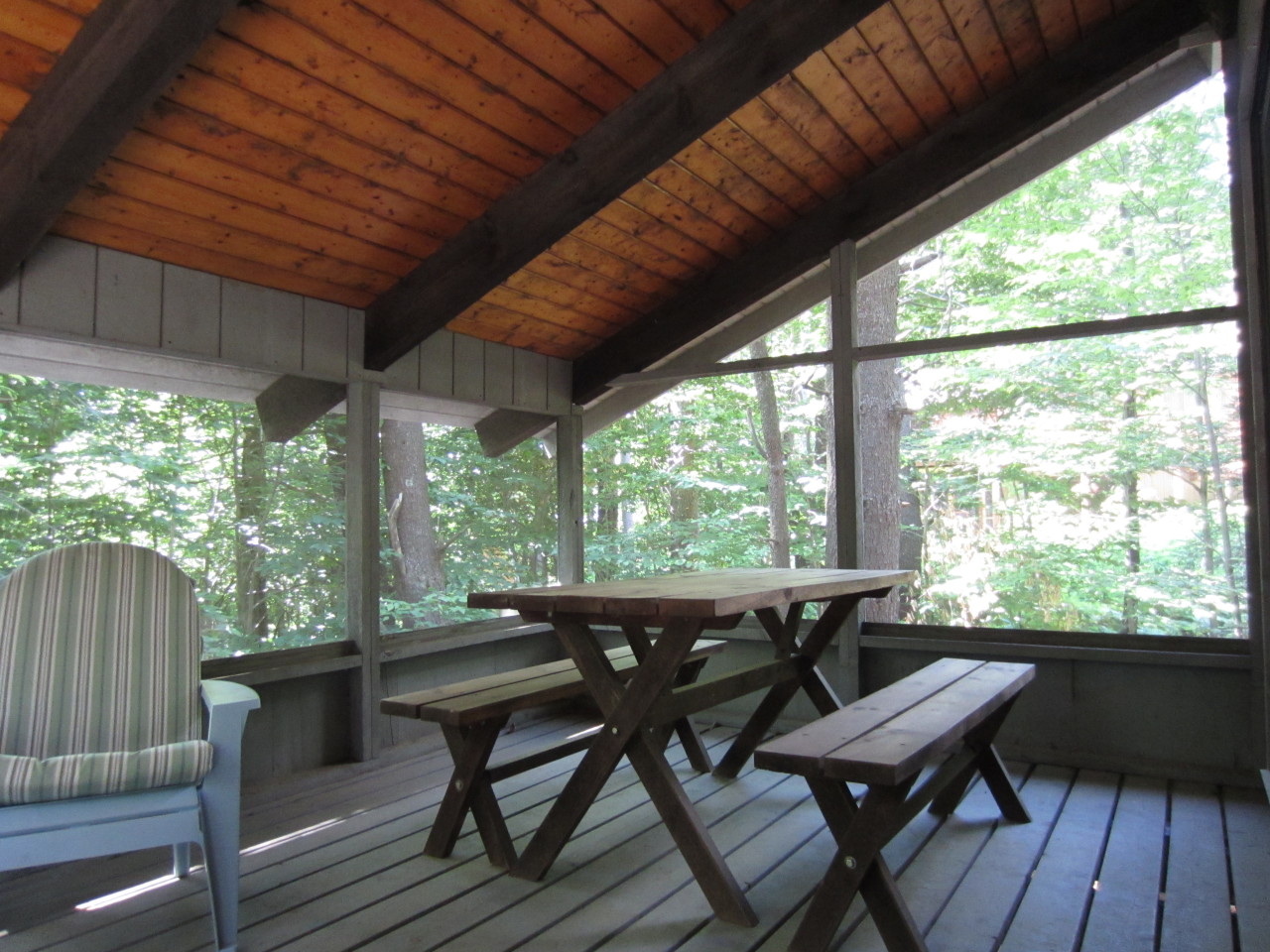 47 Slope Road Tolland, MA 01034 - Photo 14 of 19 a view of a patio with wooden floor and outdoor seating
