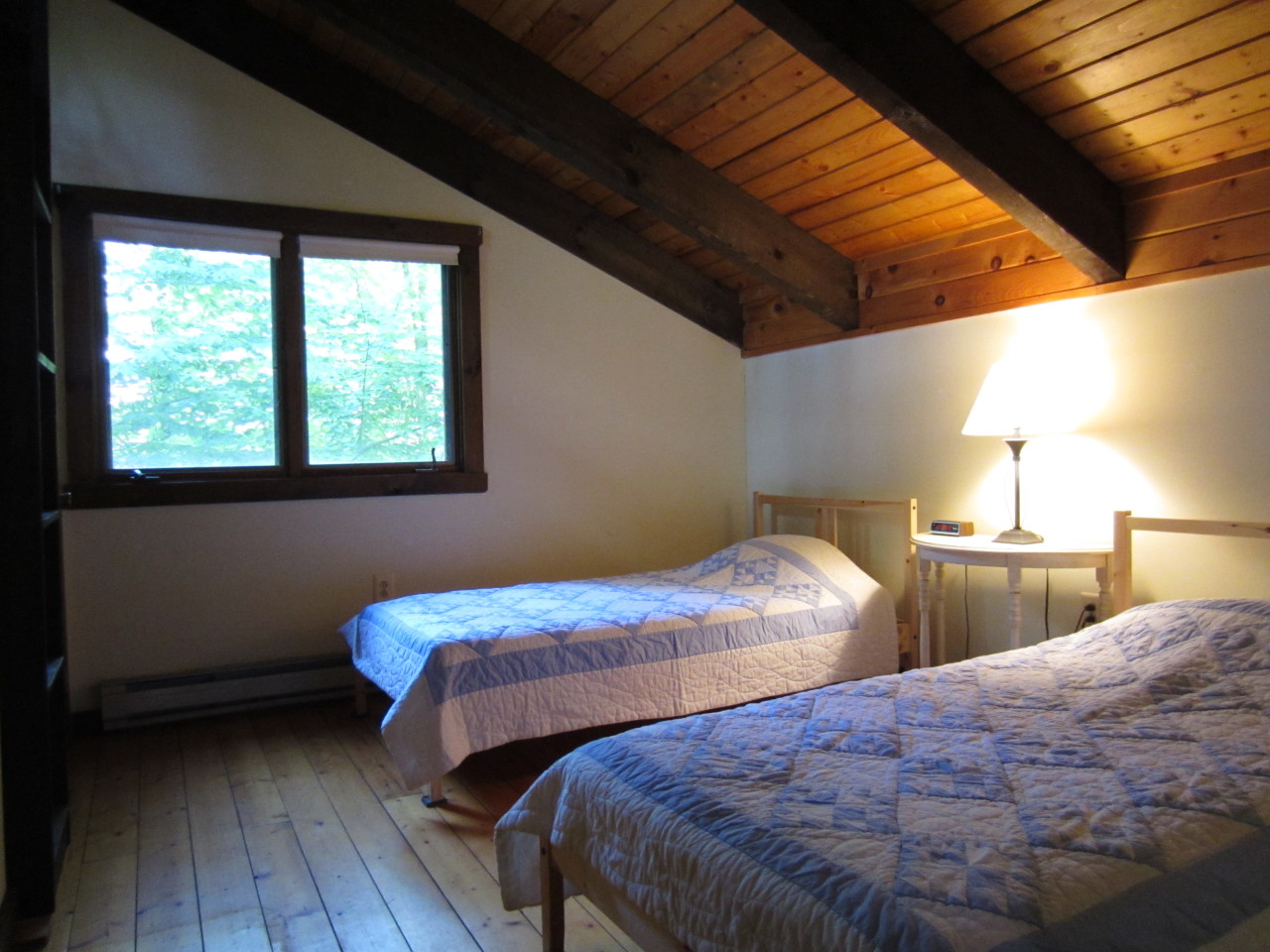47 Slope Road Tolland, MA 01034 - Photo 4 of 19 a bedroom with two beds and wooden floor