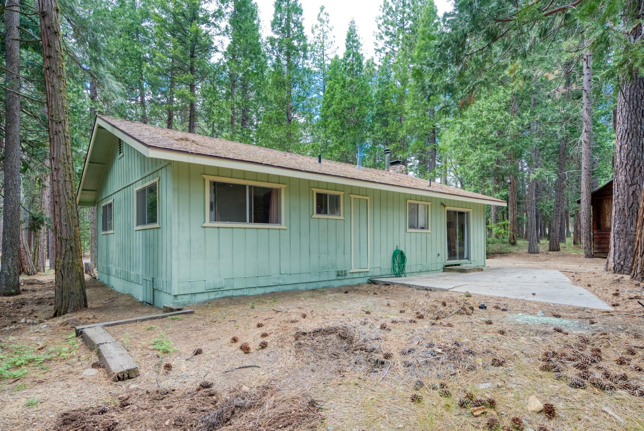 58374 Gill Ranch Road Cromberg, CA 96103 - Photo 14 of 44 a view of a house with a backyard and trees