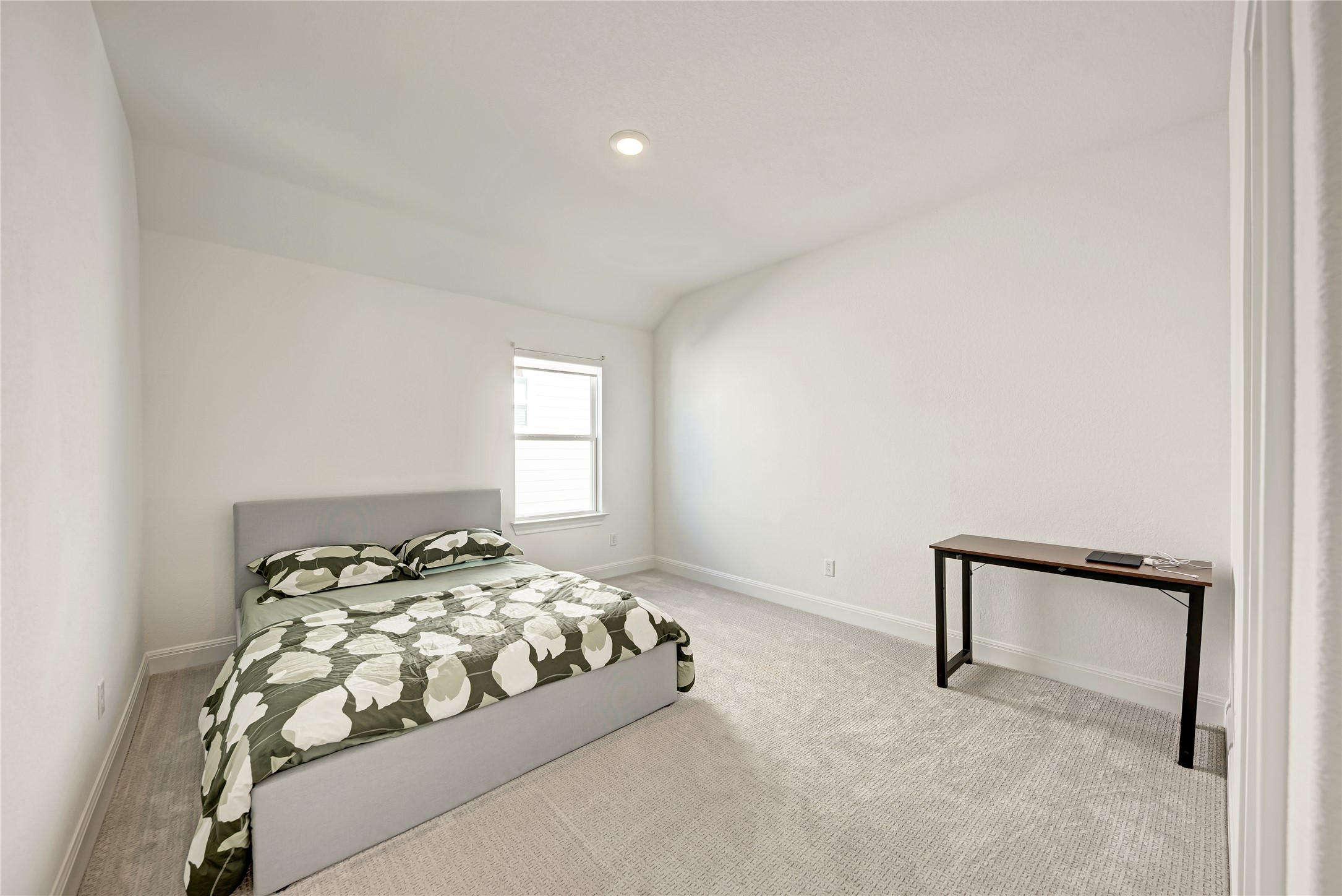316 Regatta Trail Leander, TX 78641 - Photo 32 of 39 Spacious room featuring light-colored walls, recessed ceiling lighting, and a window providing natural light