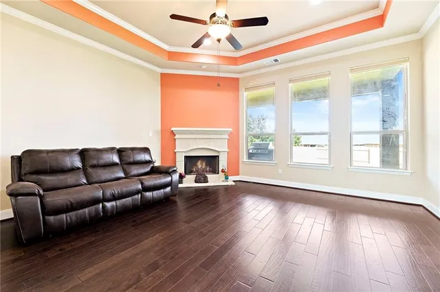 a living room with furniture and a fireplace