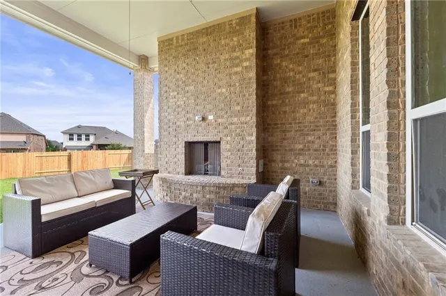 a living room with furniture wooden floor and a fireplace