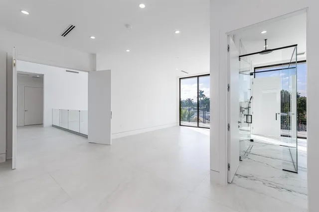 a view of a hallway with wooden shelves