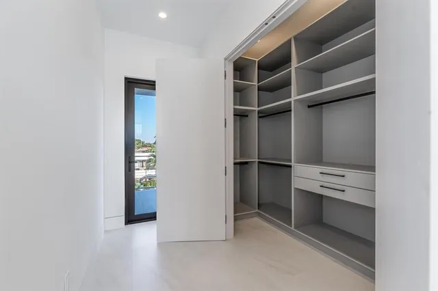 a view of an empty walk in closet