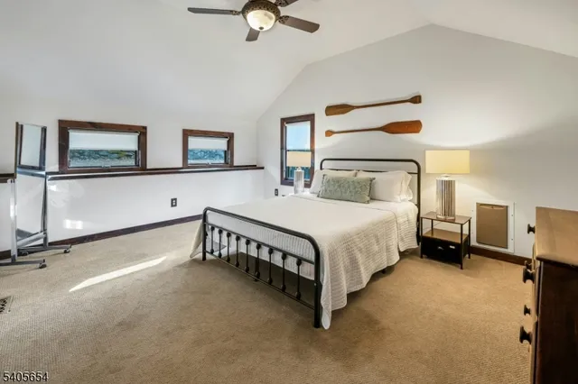 a bedroom with a bed and two night stand