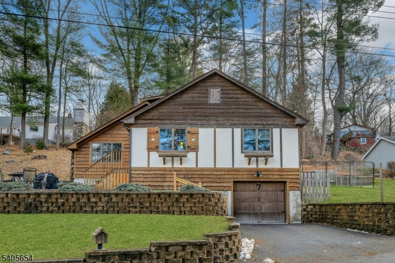 7 Hillside Road Sparta, NJ 07871 - Photo 18 of 19 a front view of a house with a garden