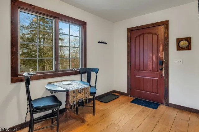 a view of a livingroom with furniture and window