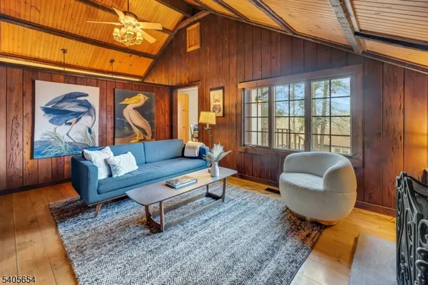 a living room with furniture and a rug