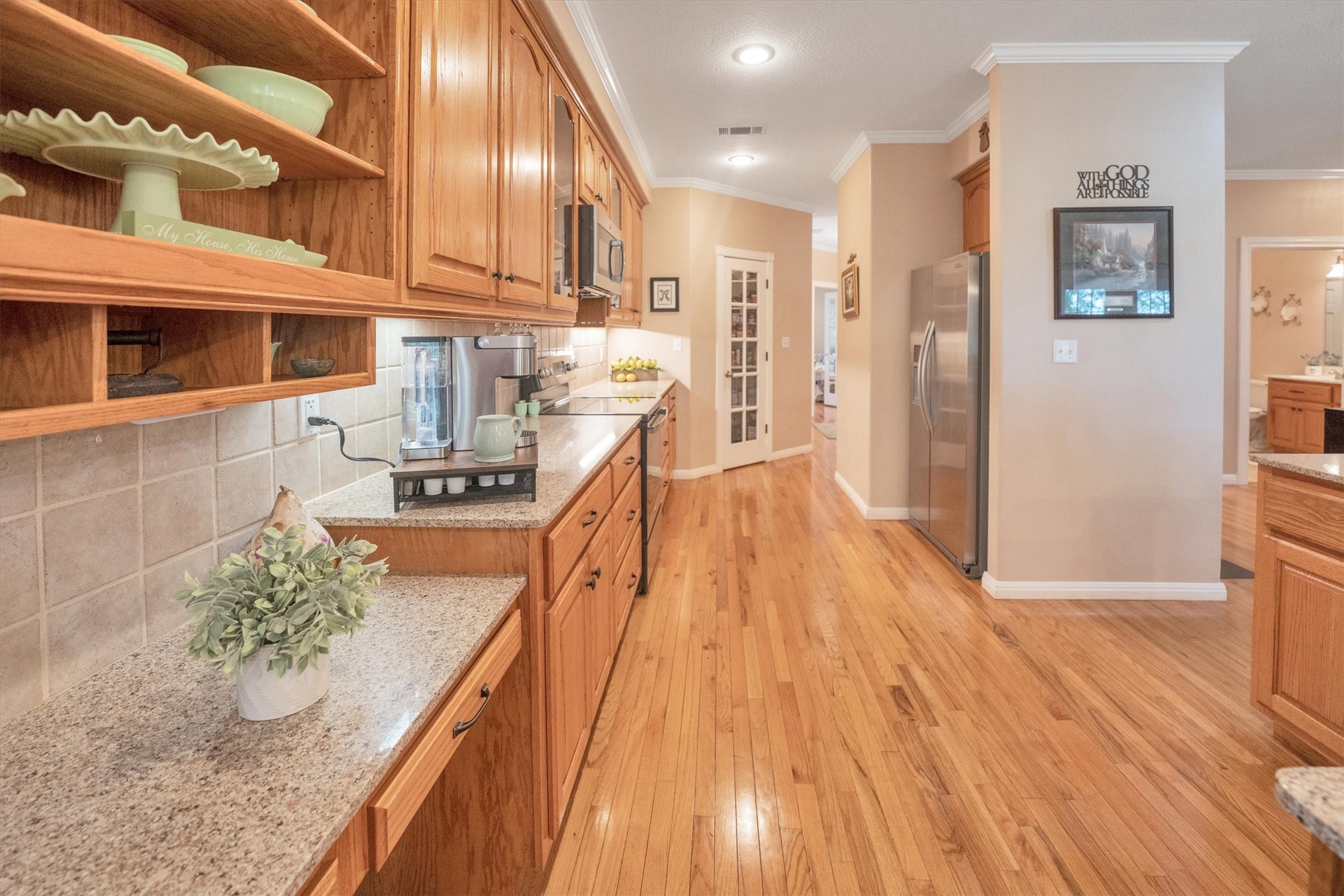 24400 Pine Valley Point Blank, TX 77364 - Photo 17 of 50 a open kitchen with stainless steel appliances granite countertop a refrigerator a stove and a wooden floors