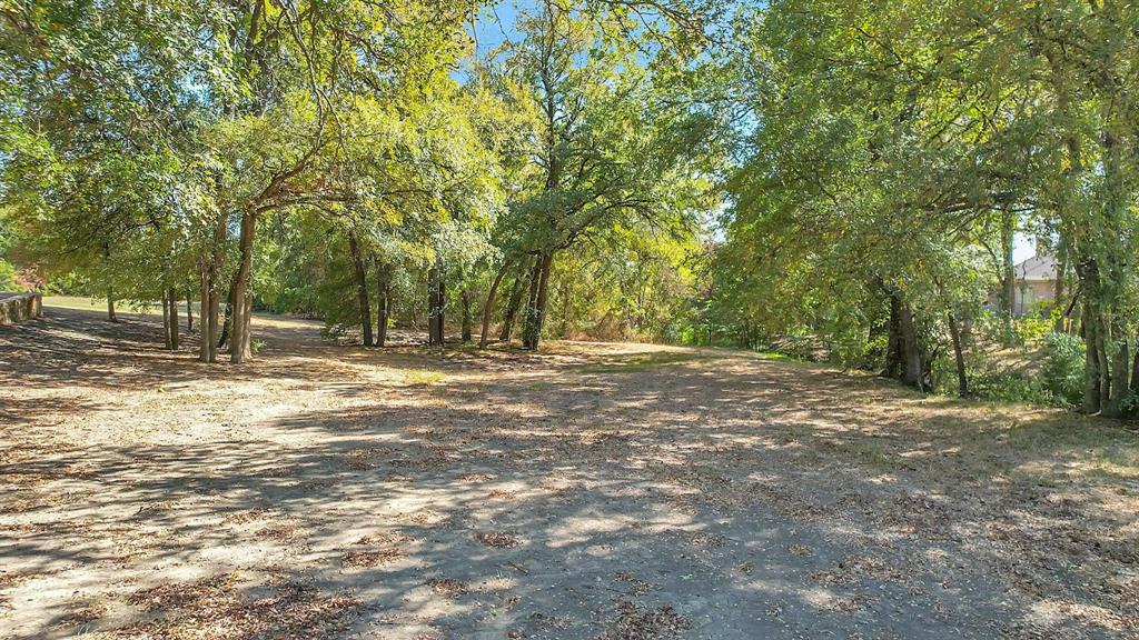 133 Falcon Point Drive Heath, TX 75032 - Photo 4 of 11 a view of outdoor space with trees