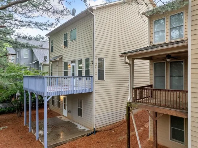 a wooden house with a large window