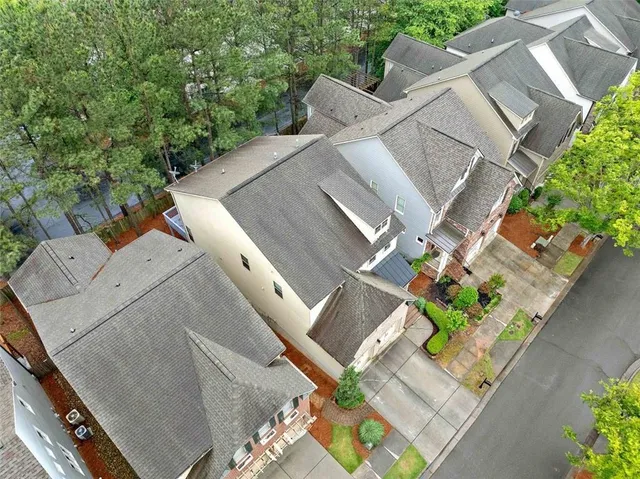 an aerial view of a house with outdoor space