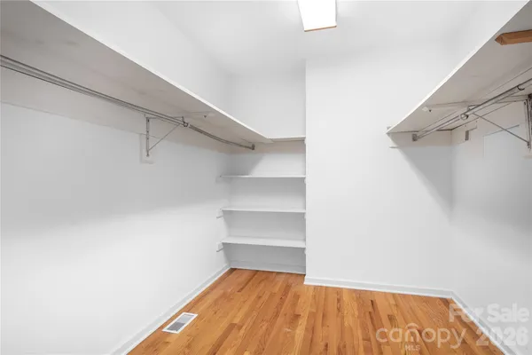 a view of an empty walk in closet
