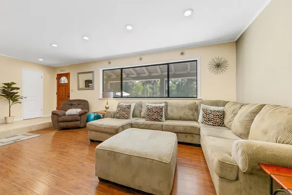 a living room with furniture and a large window