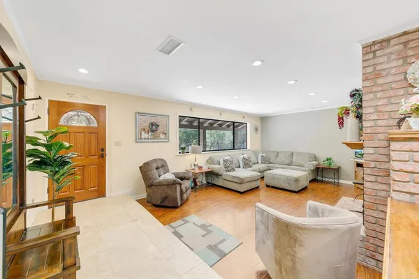 a living room with furniture and a large window