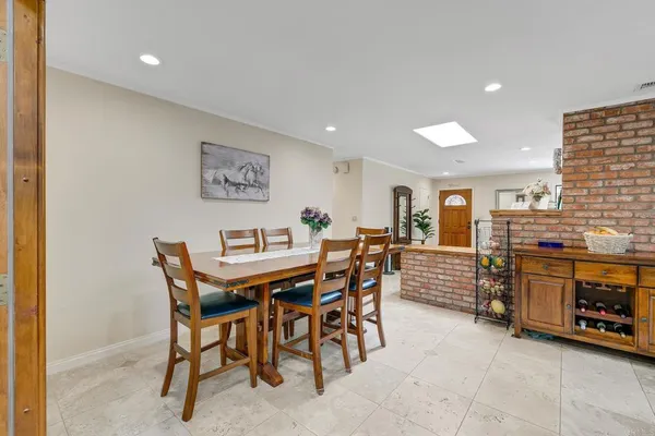 a large kitchen with kitchen island granite countertop lots of counter top space and stainless steel appliances