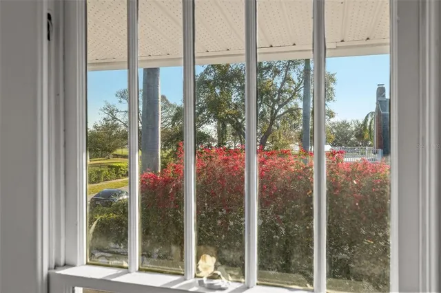 a view of a room with a floor to ceiling window