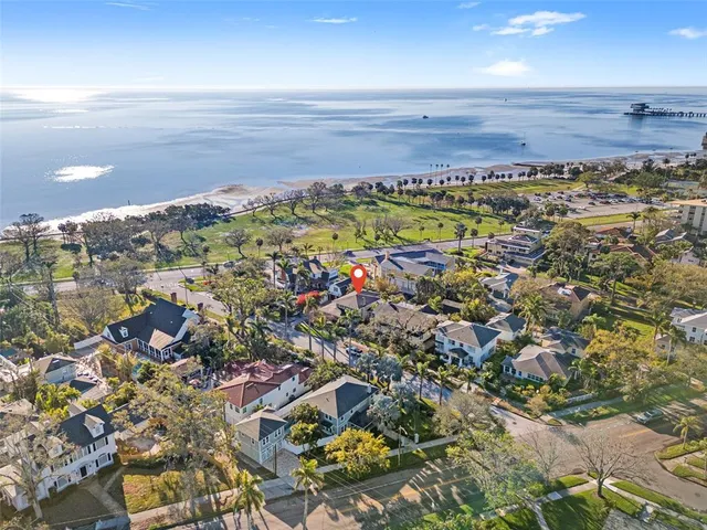 an aerial view of residential building and lake