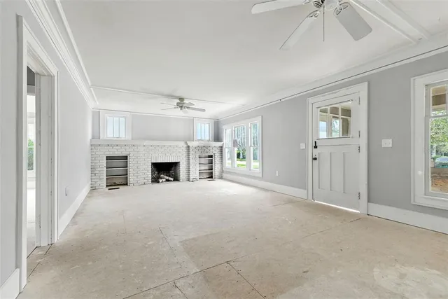 a view of empty room with a fireplace