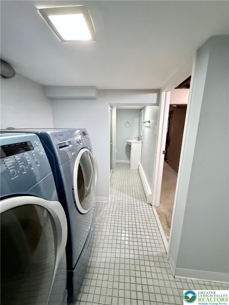 5540 Main Street Whitehall, PA 18052 - Photo 42 of 53 Functional laundry room offers practical tile flooring and overhead illumination.