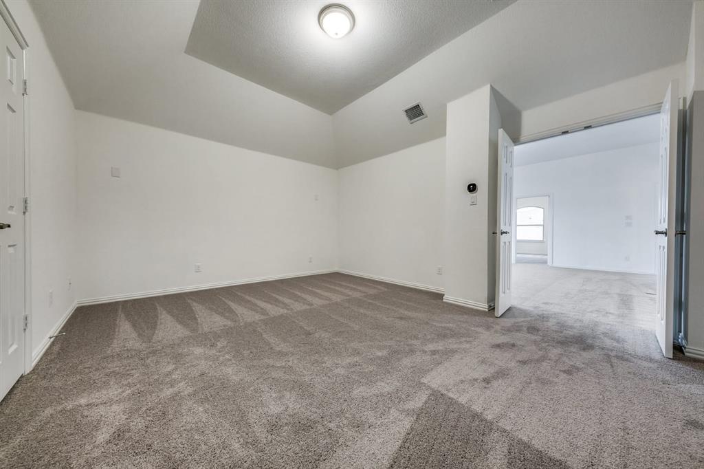 104 Sweetleaf Drive Red Oak, TX 75154 - Photo 27 of 36 The property features a spacious room with plush gray carpeting and white walls