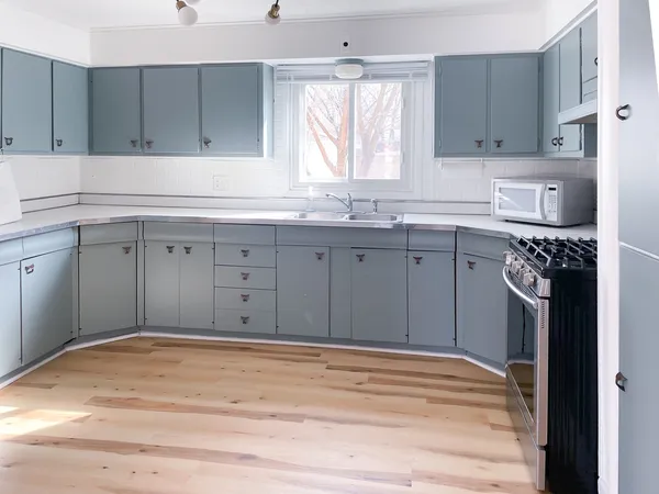a kitchen with a cabinets window and a sink
