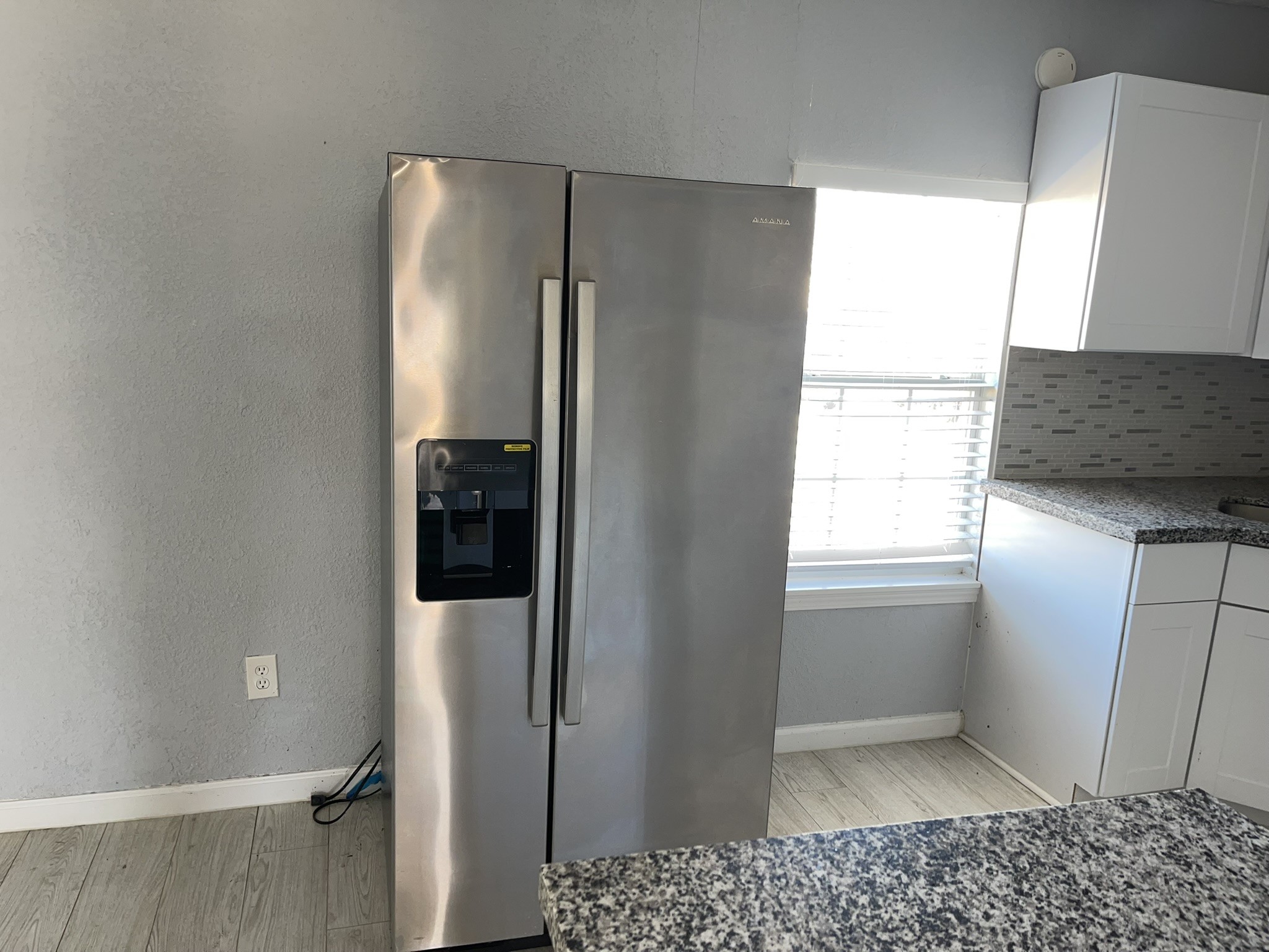 17202 Sunshine Street Houston, TX 77049 - Photo 8 of 19 a kitchen with a refrigerator and window