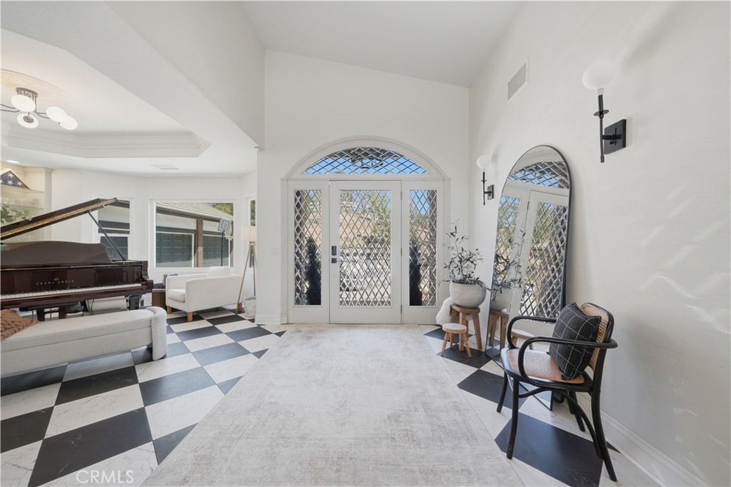 41110 Los Ranchos Circle Temecula, CA 92592 - Photo 11 of 77 a living room with furniture and a flat screen tv