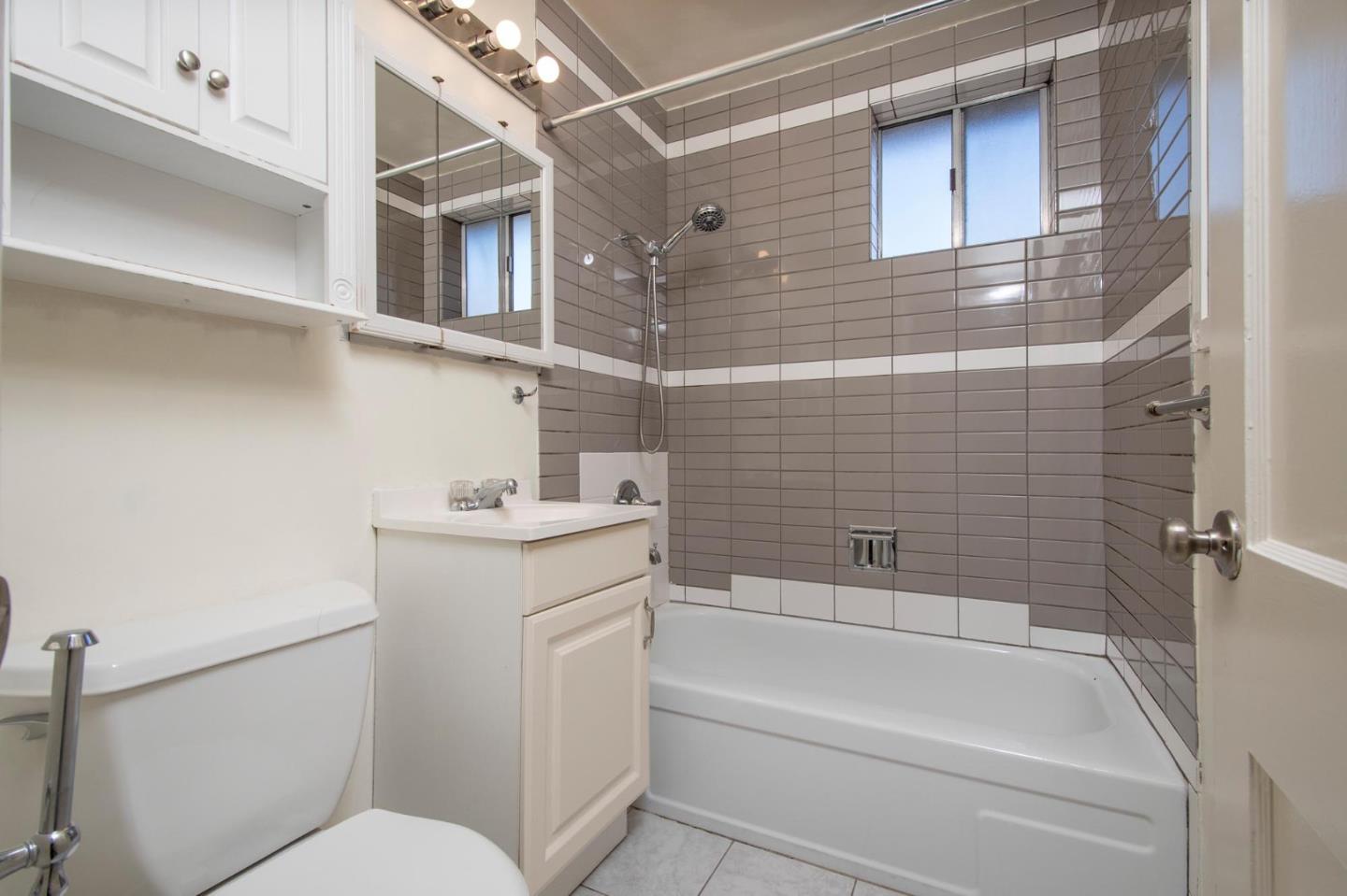 461-463 Rollins Road Burlingame, CA 94010 - Photo 22 of 25 a bathroom with a sink toilet and shower