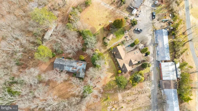 a view of a yard with wooden fence