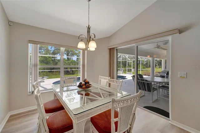 a bedroom with two beds and painting on the wall