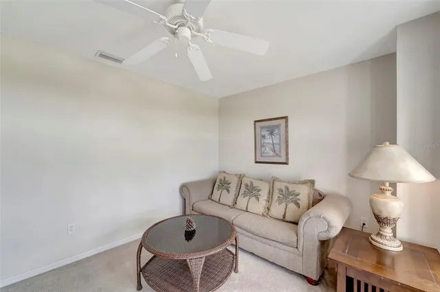 a view of a swimming pool with outdoor seating