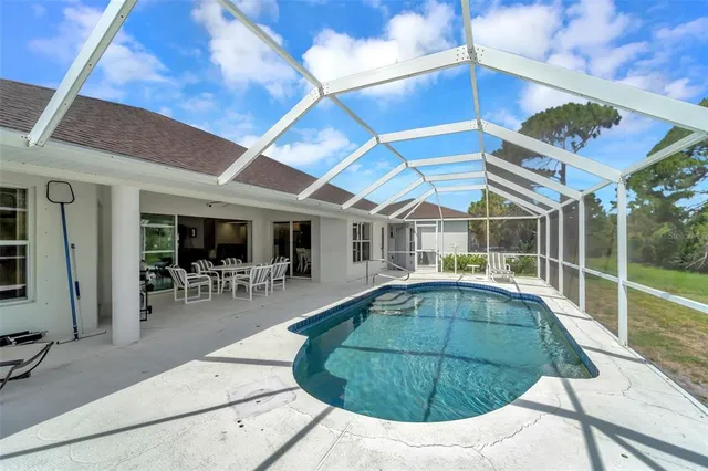 a view of a garden with plants and trees all around