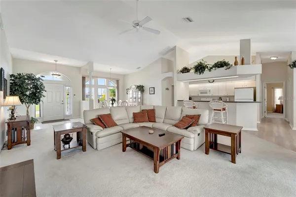 a living room with furniture and a table