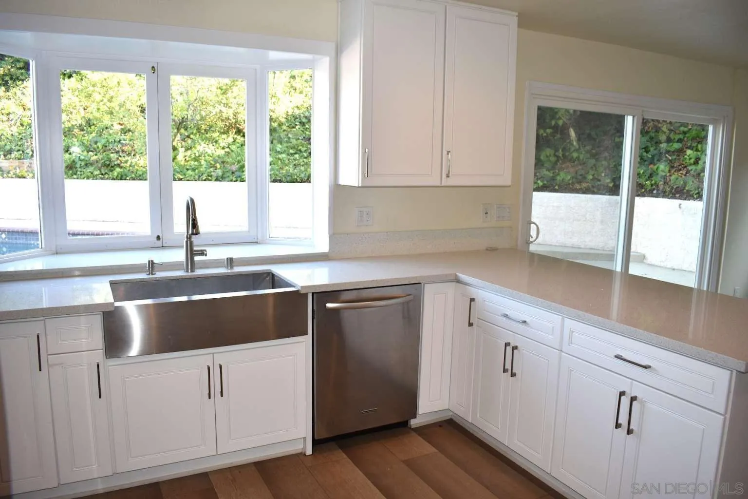 26658 Honey Creek Road Rancho Palos Verdes, CA 90275 - Photo 14 of 38 a kitchen with granite countertop white cabinets and a window