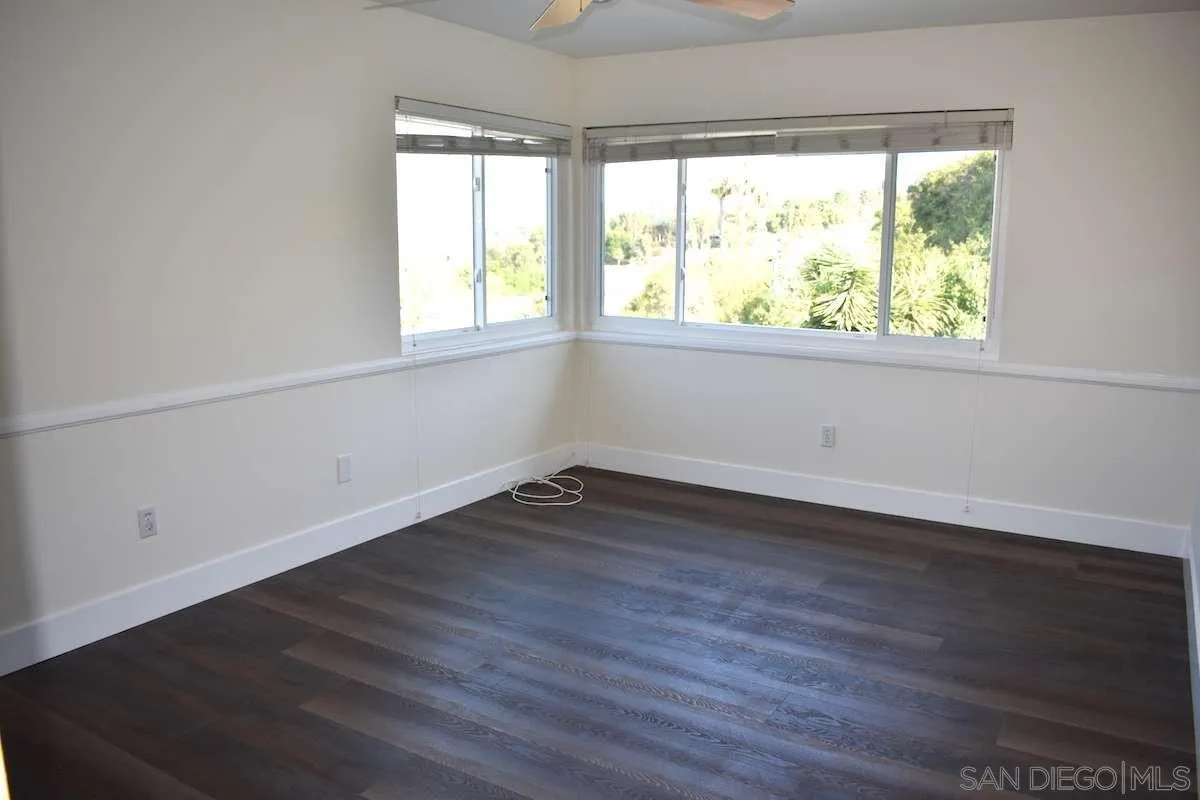 26658 Honey Creek Road Rancho Palos Verdes, CA 90275 - Photo 19 of 38 an empty room with wooden floor and windows