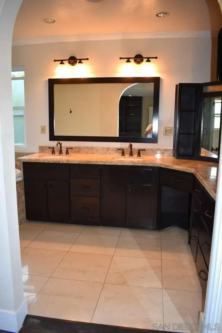 26658 Honey Creek Road Rancho Palos Verdes, CA 90275 - Photo 24 of 38 a bathroom with a sink vanity and mirror