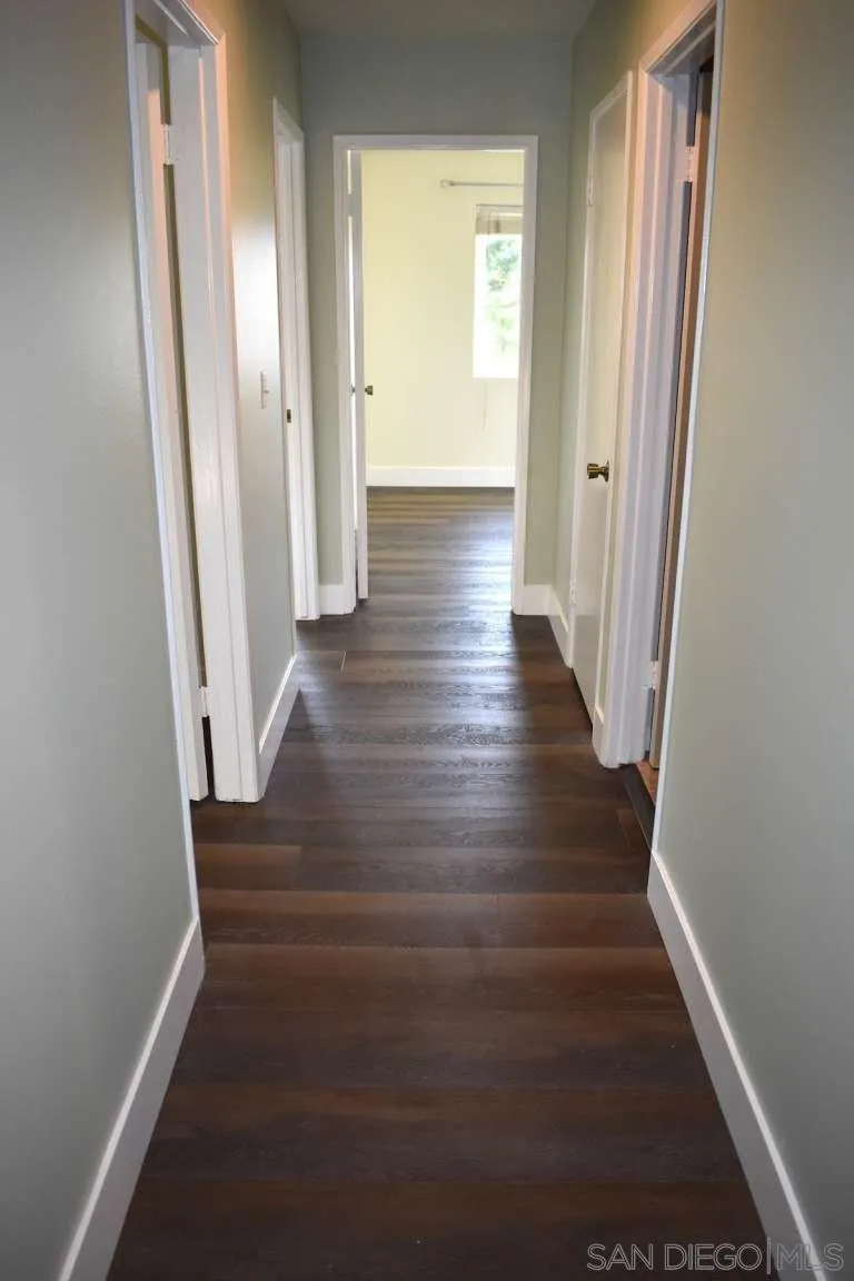 26658 Honey Creek Road Rancho Palos Verdes, CA 90275 - Photo 26 of 38 a view of a hallway with wooden floor and staircase