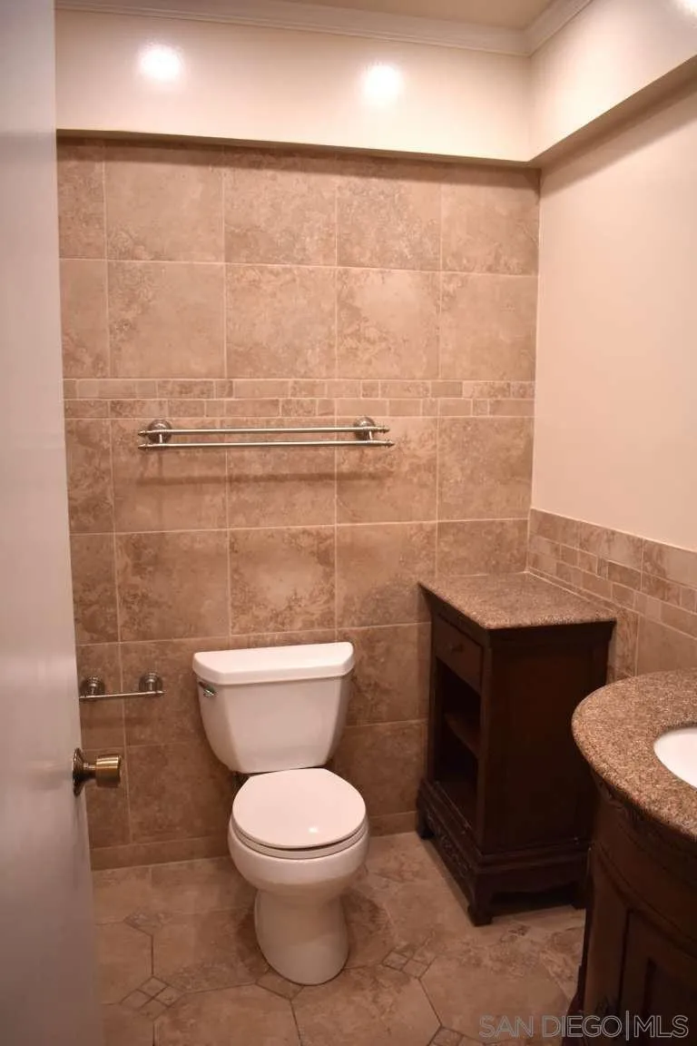 26658 Honey Creek Road Rancho Palos Verdes, CA 90275 - Photo 31 of 38 a bathroom with a toilet a sink and mirror