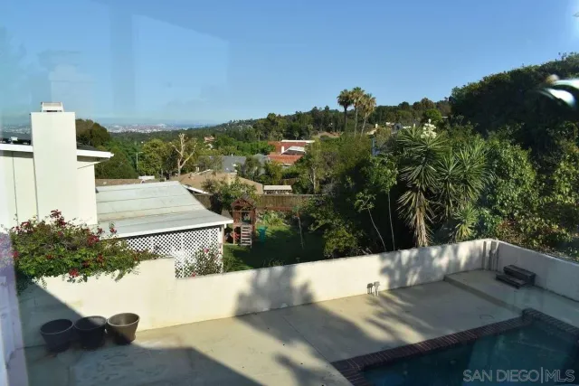 a view of a swimming pool with a patio