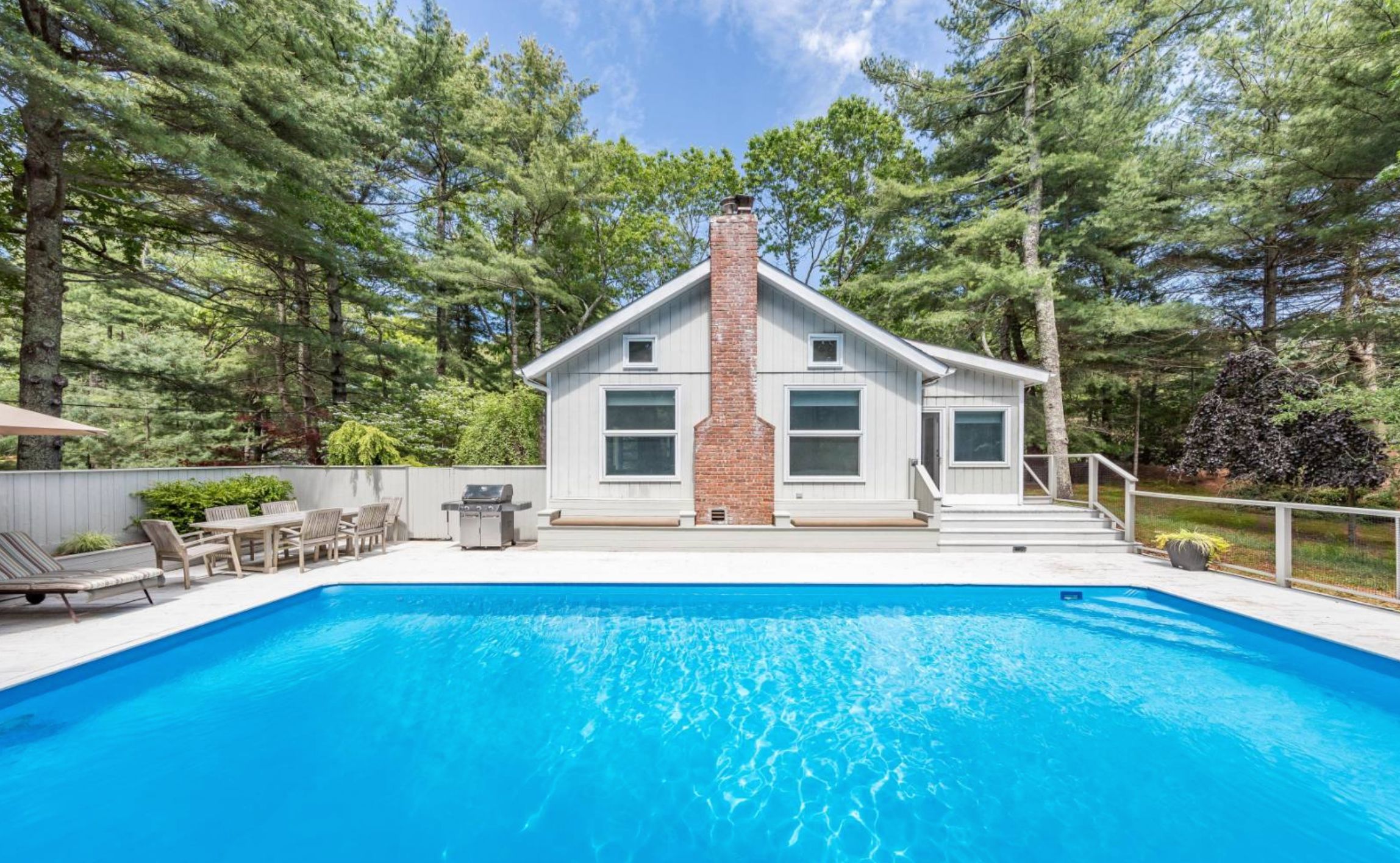 11 Malcolm Avenue East Hampton, NY 11937 - Photo 1 of 17 a front view of house with yard and seating area