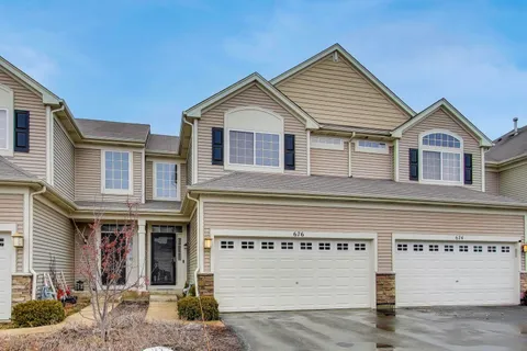a front view of a house with garage