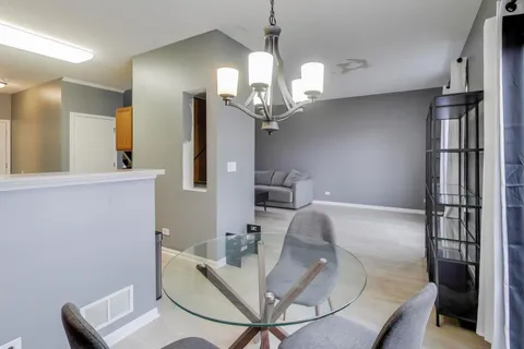 a balcony with table and chairs