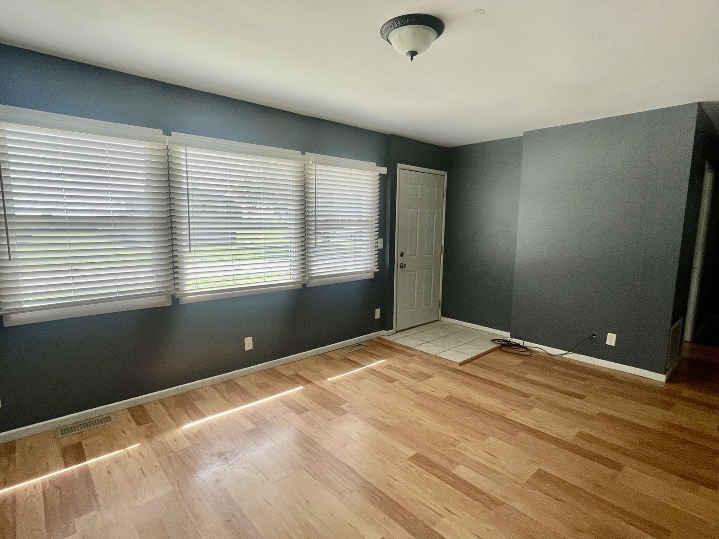 409 Elm Street Cedar Point, IL 61316 - Photo 4 of 15 a view of an empty room with a window