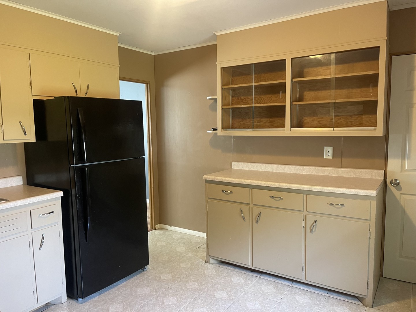 409 Elm Street Cedar Point, IL 61316 - Photo 8 of 15 a kitchen with a refrigerator and window